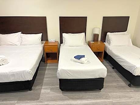 Family Room with 1 Queen Bed and 3 Single Beds