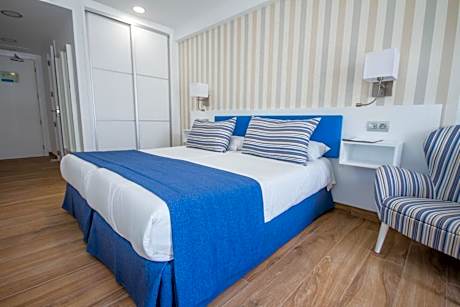 Superior Double Room Top Floor Balcony with Side Sea View