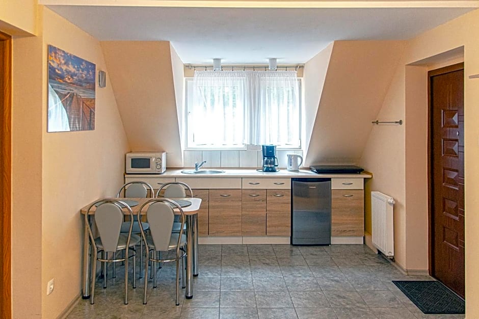 Sztil - Apartamenty i drewniane domki