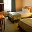 Magnuson Grand Pioneer Inn And Suites