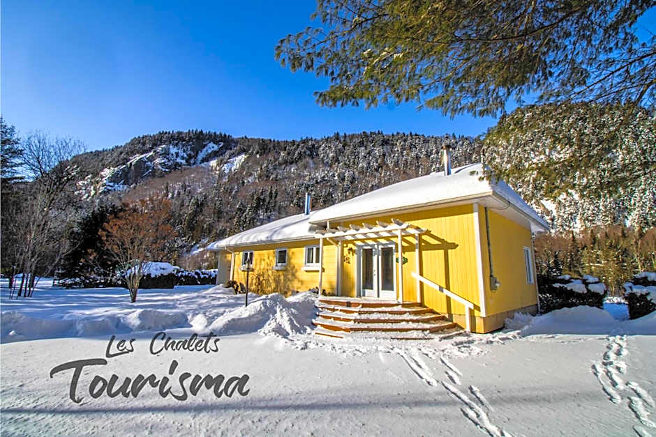 Tranquil Riverfront Chalet with Hot Tub