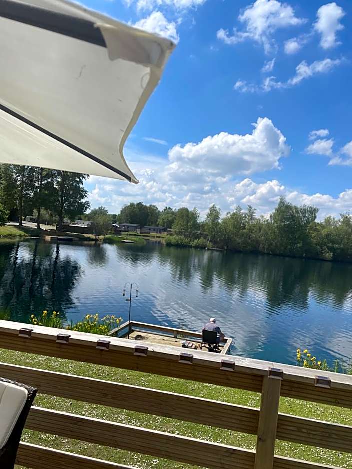 Award winning Serenity Lodge with outstanding lakeside views from the hot tub , at Tallington Lakes Leisure Park, Stamford