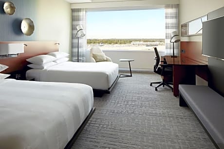 Guest Room with Two Queen Beds and Airport View