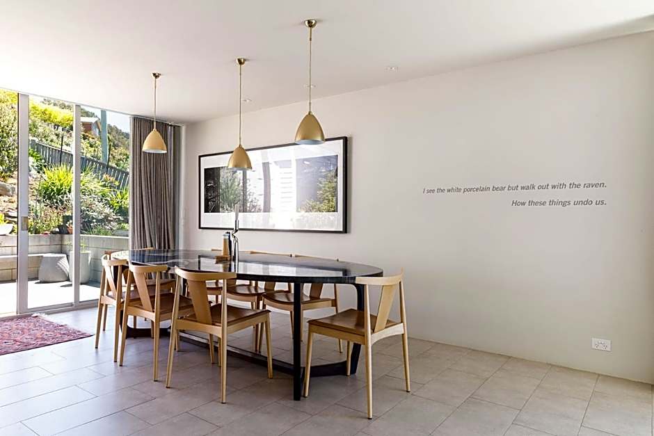 Architectural glass house with ocean views