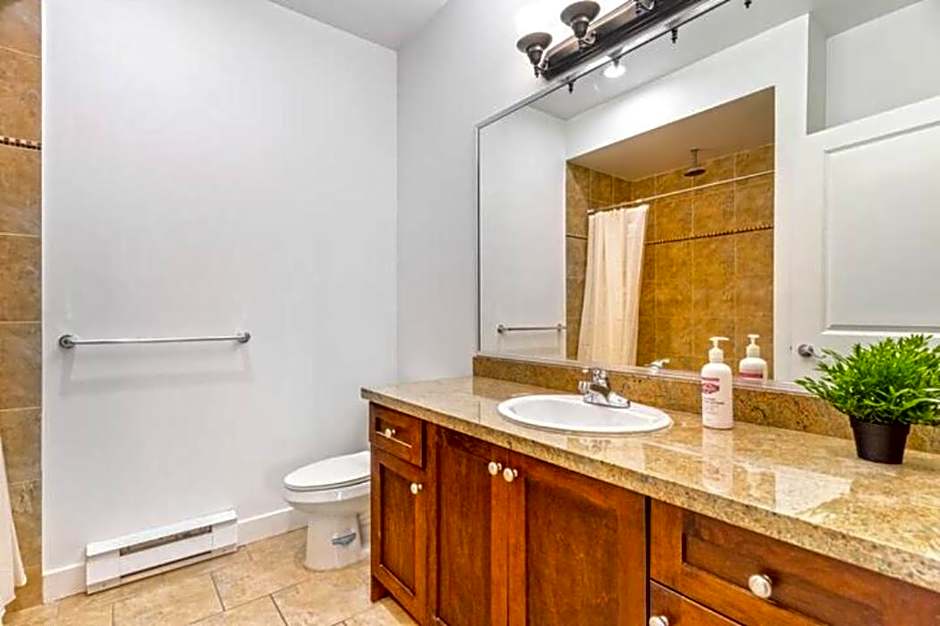 Private apartment with 2 bedrooms, 2 bathrooms, living area, laundry included