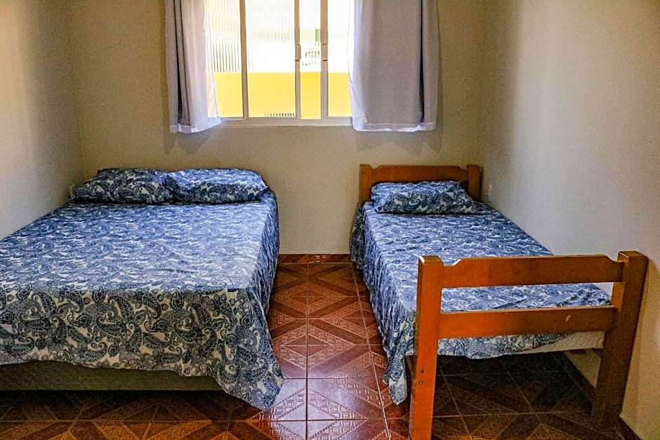 Casa pé na areia com vista especial do pôr do sol.