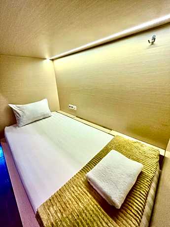 Single Bed in Dormitory Room