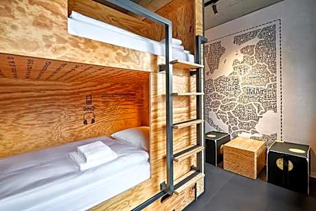 Bed in a Quadruple room with shared bathroom