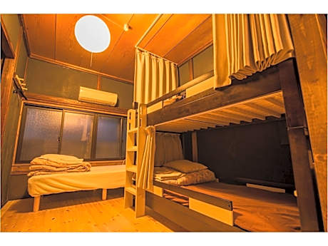 Bed in Japanese-Style Male Dormitory Room