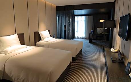 Two-Bedroom Deluxe Suite with One King Bed and Two Double Beds