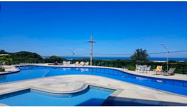 Apartamento aconchegante vista mar e piscina em cond de Arraial do Cabo