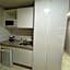 Suíte luxo com tela de cinema no América Towers Studio Residence