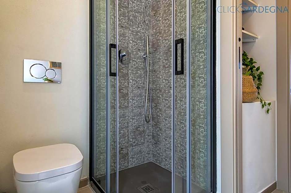 ClickSardinia Alghero Spectacular waterfront Neptune apartment with sea-facing terraces and garden