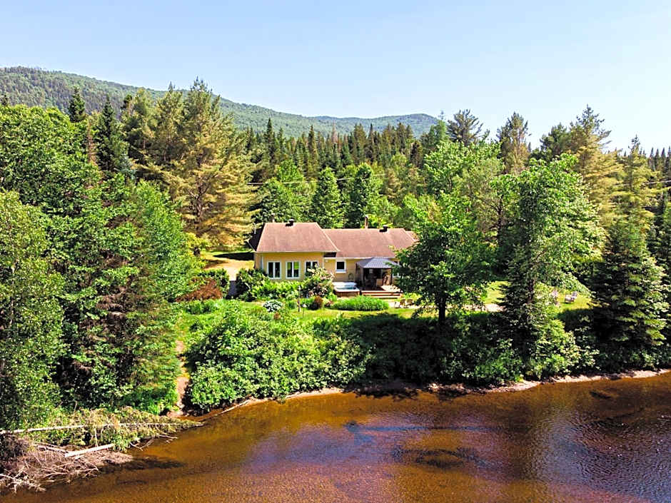 Tranquil Riverfront Chalet with Hot Tub