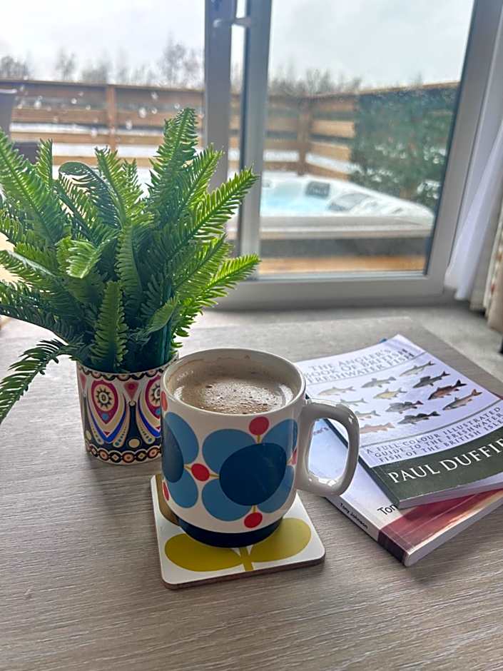 Award winning Serenity Lodge with outstanding lakeside views from the hot tub , at Tallington Lakes Leisure Park, Stamford