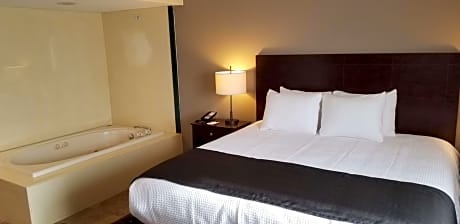 Suite-1 King Bed, Non-Smoking, Pillow Top Mattress, Jacuzzi, Sitting Area, Microwave And Refrigerator, High Speed Internet Access, Full Breakfast