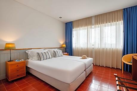 Three-Bedroom Apartment with Balcony and Pool View