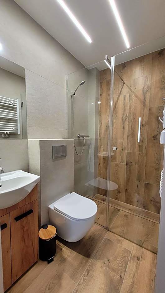 Wrzosowe Wzgórze 5 - Studia i Apartamenty