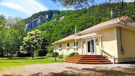 Tranquil Riverfront Chalet with Hot Tub