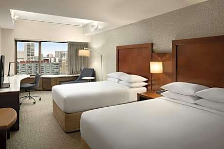 Guest Room with Two Double Beds and City View