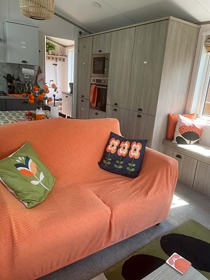 Award winning Serenity Lodge with outstanding lakeside views from the hot tub , at Tallington Lakes Leisure Park, Stamford