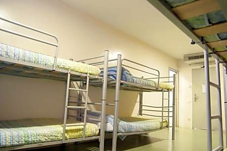 bed in 8-bed dormitory with private bathroom