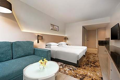 Deluxe Double Room with Two Single Beds and Sofa Bed