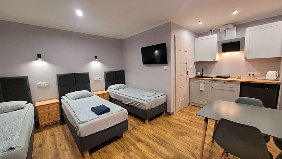 Wrzosowe Wzgórze 5 - Studia i Apartamenty