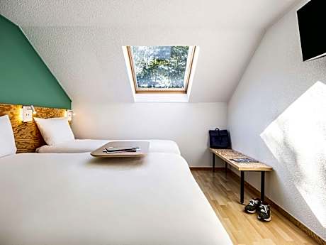 family room with one double and one single bed