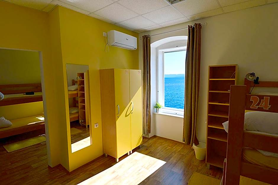 Photo 1 of 9 of Bed in 10-Bed Mixed Dormitory Room with Sea View