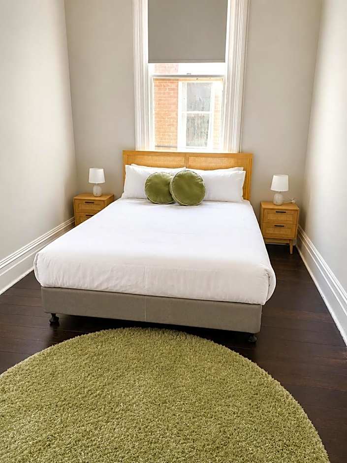 Photo 1 of 7 of Queen Room with Shared Bathroom