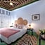 Riad Le J