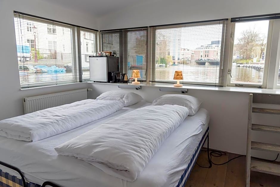 HouseBoat next to AMSTEL