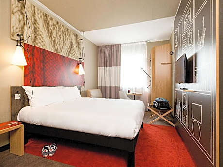 Room with one big bed and sofa