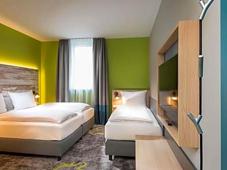 family room with one double and one single bed