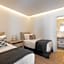 NĒRO Suites by NOMÉE Hospitality Group
