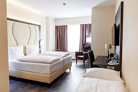 Deluxe Quadruple Room with One Double and Two Single Beds