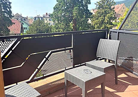 Larger Superior King Room with Balcony - Non-Smoking