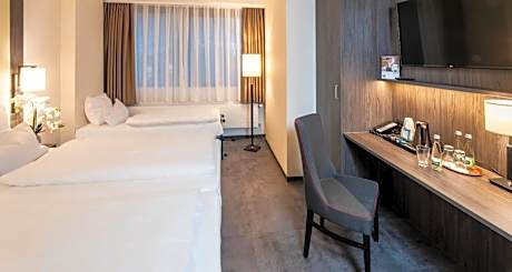 Deluxe Quadruple Room with One Double and Two Single Beds