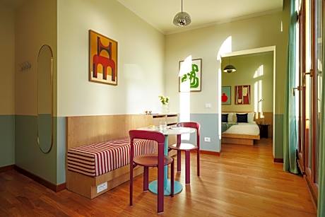 Large Room with Separate Living Area and Balcony