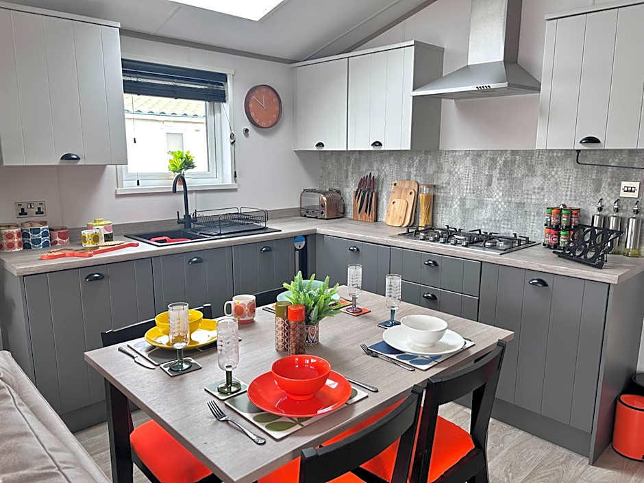 Award winning Serenity Lodge with outstanding lakeside views from the hot tub , at Tallington Lakes Leisure Park, Stamford