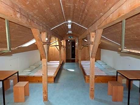 Single Bed in Dormitory Room