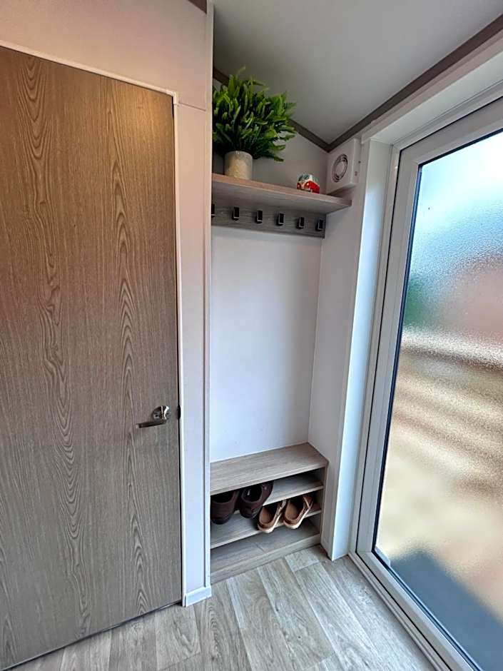 Award winning Serenity Lodge with outstanding lakeside views from the hot tub , at Tallington Lakes Leisure Park, Stamford