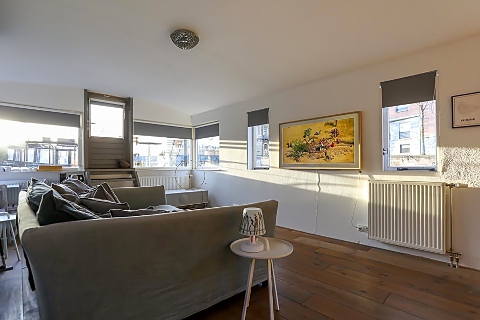 HouseBoat next to AMSTEL