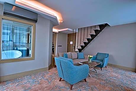 Duplex Suite with One Queen Bed and Two Single Beds with Balcony and View