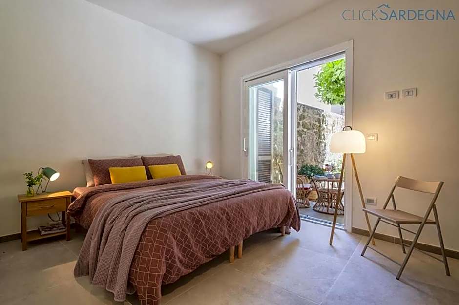 ClickSardinia Alghero Spectacular waterfront Neptune apartment with sea-facing terraces and garden