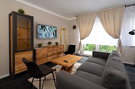 One-Bedroom Apartment with Balcony and Garden Access