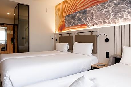 Standard Room With 2 Single Size Beds And Single Sofa