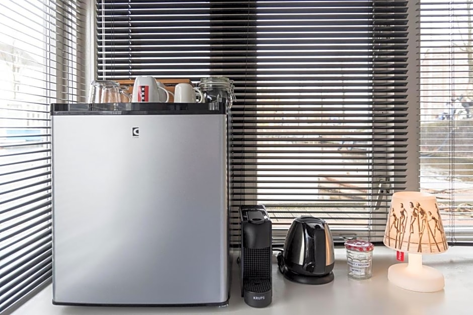 HouseBoat next to AMSTEL