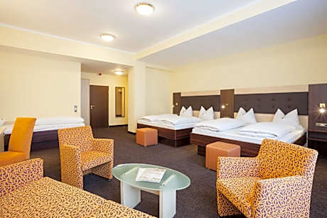 Family Room with Two Queen and One Sofa Bed